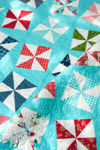 Shuffle charm pack quilt. Really cute pinwheel quilt in Gooseberry fabric by Lella Boutique for Moda Fabrics.