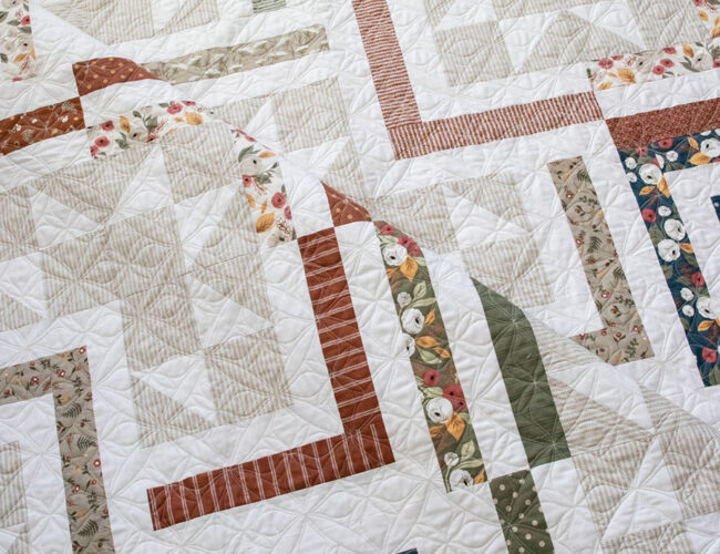 FREE Smart Cookie jelly roll quilt PDF pattern by Lella Boutique. Cool log cabin design in Flower Pot fabric. Download the pattern here.