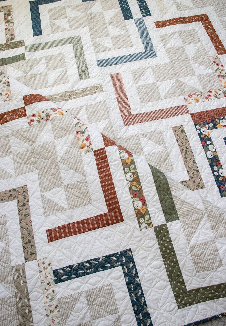 FREE Smart Cookie jelly roll quilt PDF pattern by Lella Boutique. Cool log cabin design in Flower Pot fabric. Download the pattern here.