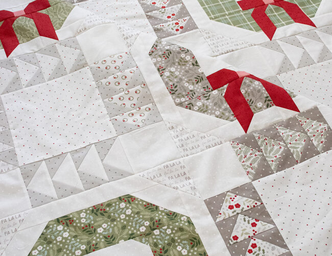 Good Tidings wreath quilt by Vanessa Goertzen of Lella Boutique. Make it with fat quarters. Fabric is Christmas Eve by Lella Boutique for Moda Fabrics (May 2023). Download the PDF pattern here!