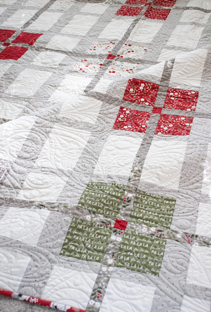 Forever Plaid layer cake quilt by Vanessa Goertzen of Lella Boutique. Fabric is Christmas Eve for Moda Fabrics (arriving May 2023).