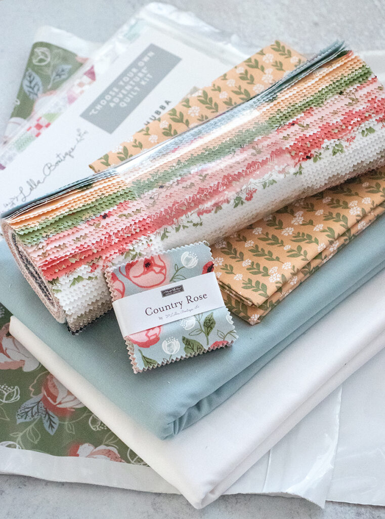 Choose Your Adventure quit kit in Country Rose fabric by Lella Boutique. 1 kit, 4 possibilities! Kit includes Hubba Hubba, Butterfly Patch, Busybody, and Easy Breezy layer cake patterns and materials to make whichever one you choose. Grab a kit here before they're gone!