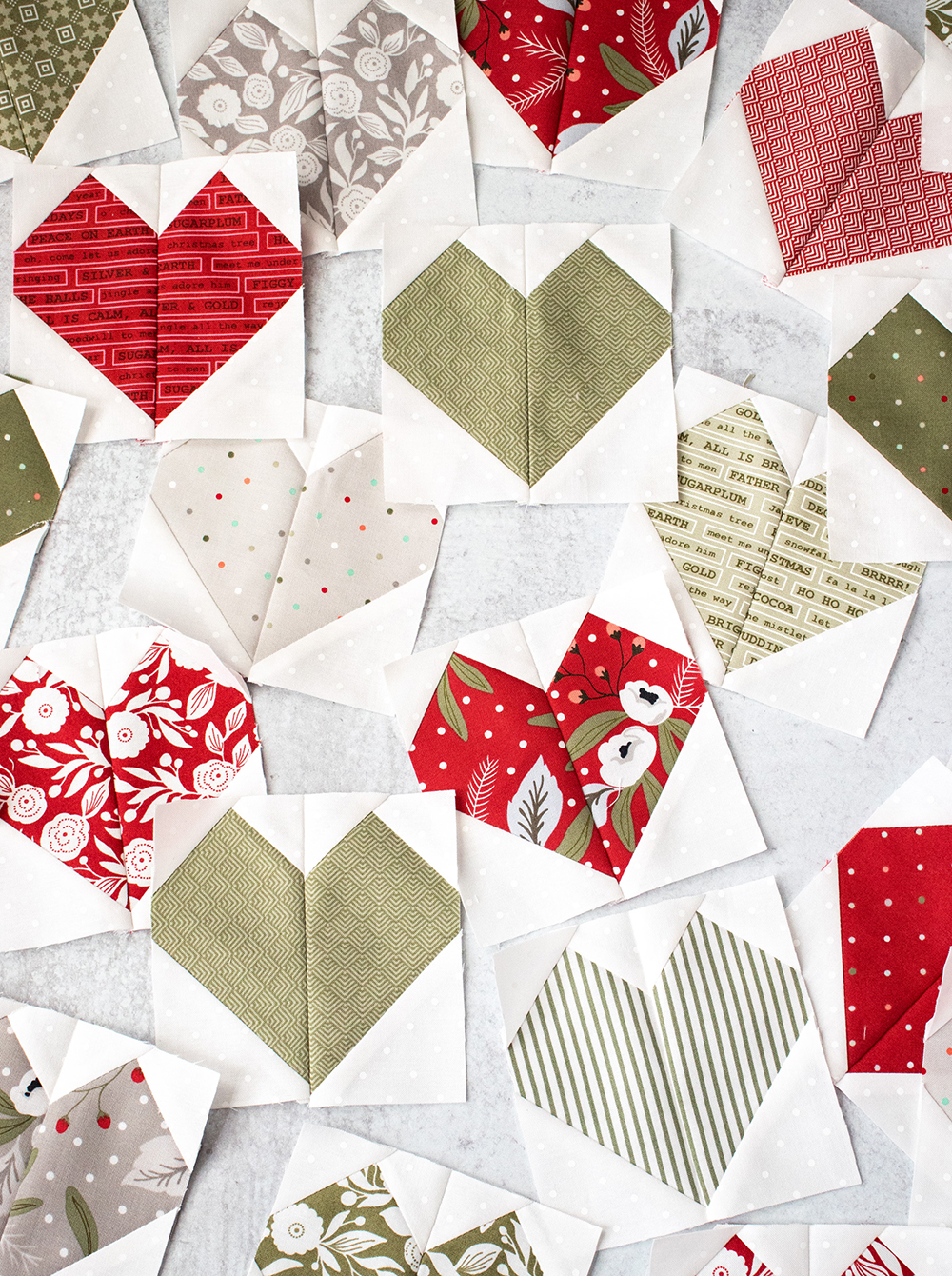 Heart blocks from the Lovey Dovey quilt pattern. Fabric is Christmas Morning by Lella Boutique for Moda Fabrics.