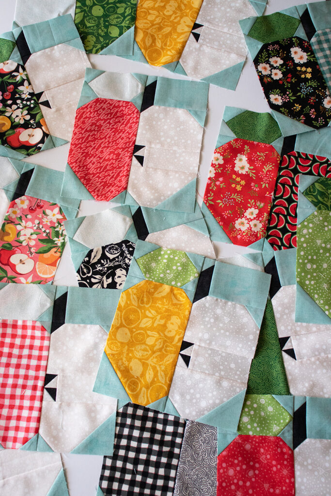 Apple Dandy quilt by Lella Boutique for BasicGrey. Layer Cake quilt made in Fruit Loop fabric.