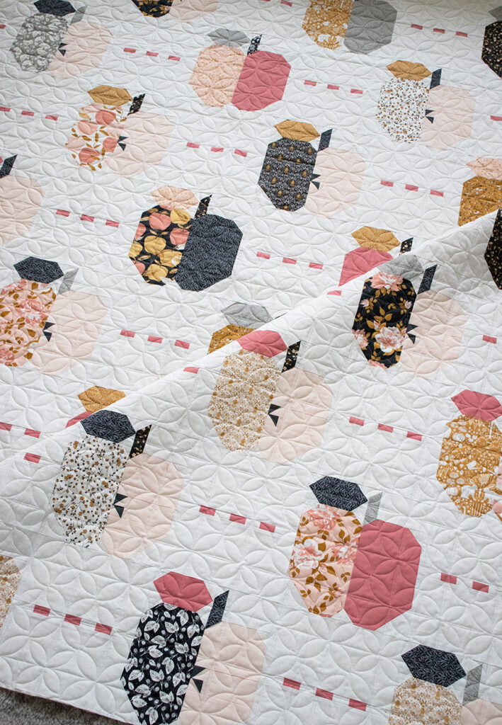 Apple Dandy quilt by Lella Boutique for BasicGrey. Layer Cake quilt made in Midnight in the Garden fabric by Sweetfire Road for Moda Fabrics.