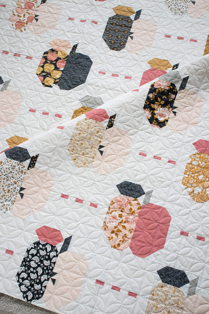 Apple Dandy quilt by Lella Boutique for BasicGrey. Layer Cake quilt made in Midnight in the Garden fabric by Sweetfire Road for Moda Fabrics.