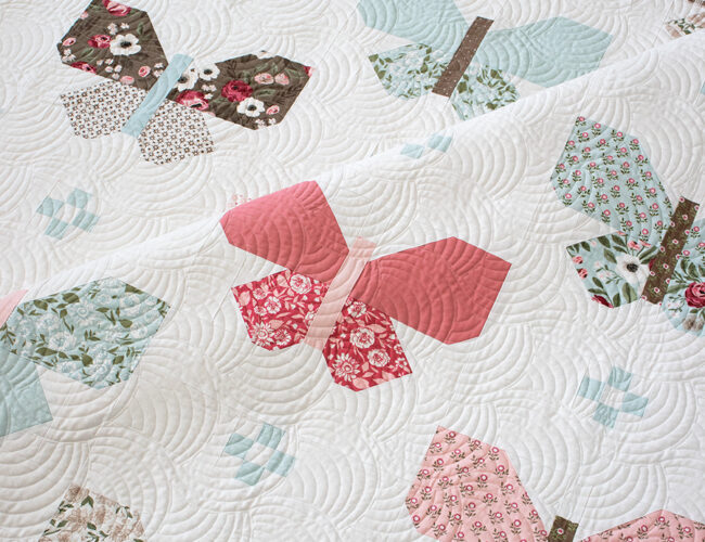 "Flutter" butterfly quilt by Lella Boutique. Fat eighth friendly. Simple butterfly quilt made in Lovestruck fabric by Lella Boutique for Moda Fabrics (Nov 2023). Download the PDF here.