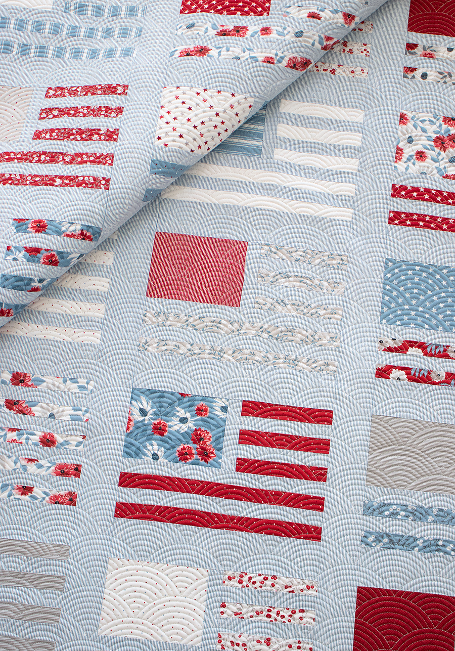 Miss Americana modern flag quilt by Vanessa Goertzen of Lella Boutique. Make it with fat quarters or a honeybun. Fabric is Old Glory by Lella Boutique for Moda Fabrics.