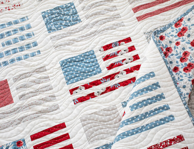 Miss Americana modern flag quilt by Vanessa Goertzen of Lella Boutique. Make it with fat quarters or a honeybun. Fabric is Old Glory by Lella Boutique for Moda Fabrics arriving Feb 2024.