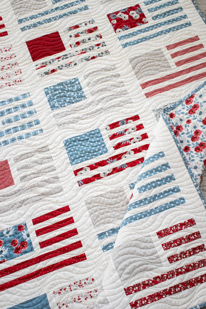 Miss Americana modern flag quilt by Vanessa Goertzen of Lella Boutique. Make it with fat quarters or a honeybun. Fabric is Old Glory by Lella Boutique for Moda Fabrics arriving Feb 2024.