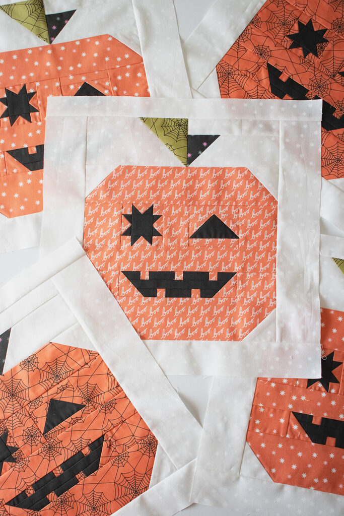 Tricks & Treats Halloween quilt by Vanessa Goertzen of Lella Boutique. Cute pumpkin and candy corn quilt in Hey Boo fabric by Lella Boutique for Moda Fabrics (April 2024). Download the PDF here.