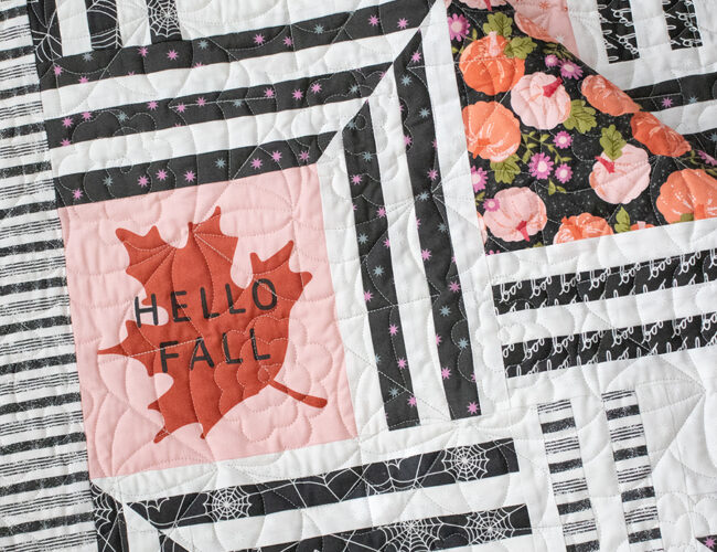 The Web - Halloween quilt of a modern spider web using the Hey Boo fabric panel, a Layer Cake, and your favorite charcoal prints. Fabric is Hey Boo by Lella Boutique for Moda Fabrics shipping to shops April 2024. Download the PDF here!