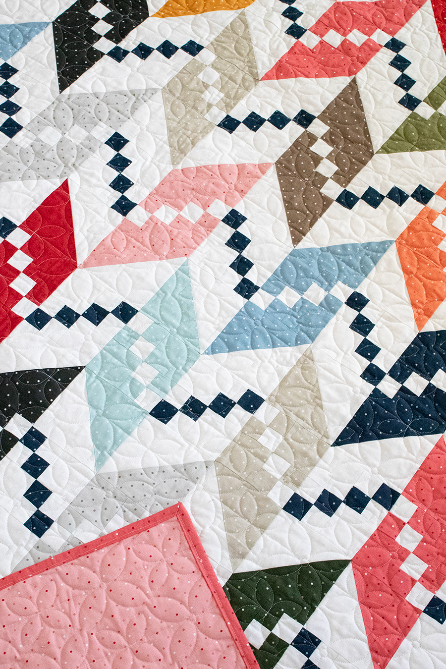Persnickety knit herringbone quilt design. Make it with a layer cake or charm packs. Fabric is Magic Dot by Lella Boutique for Moda Fabrics.