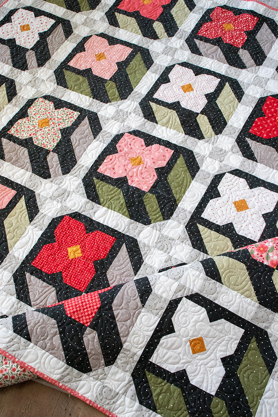 Flower Press layer cake quilt in Love Blooms fabric by Lella Boutique for Moda Fabrics. Cute flower patchwork block!