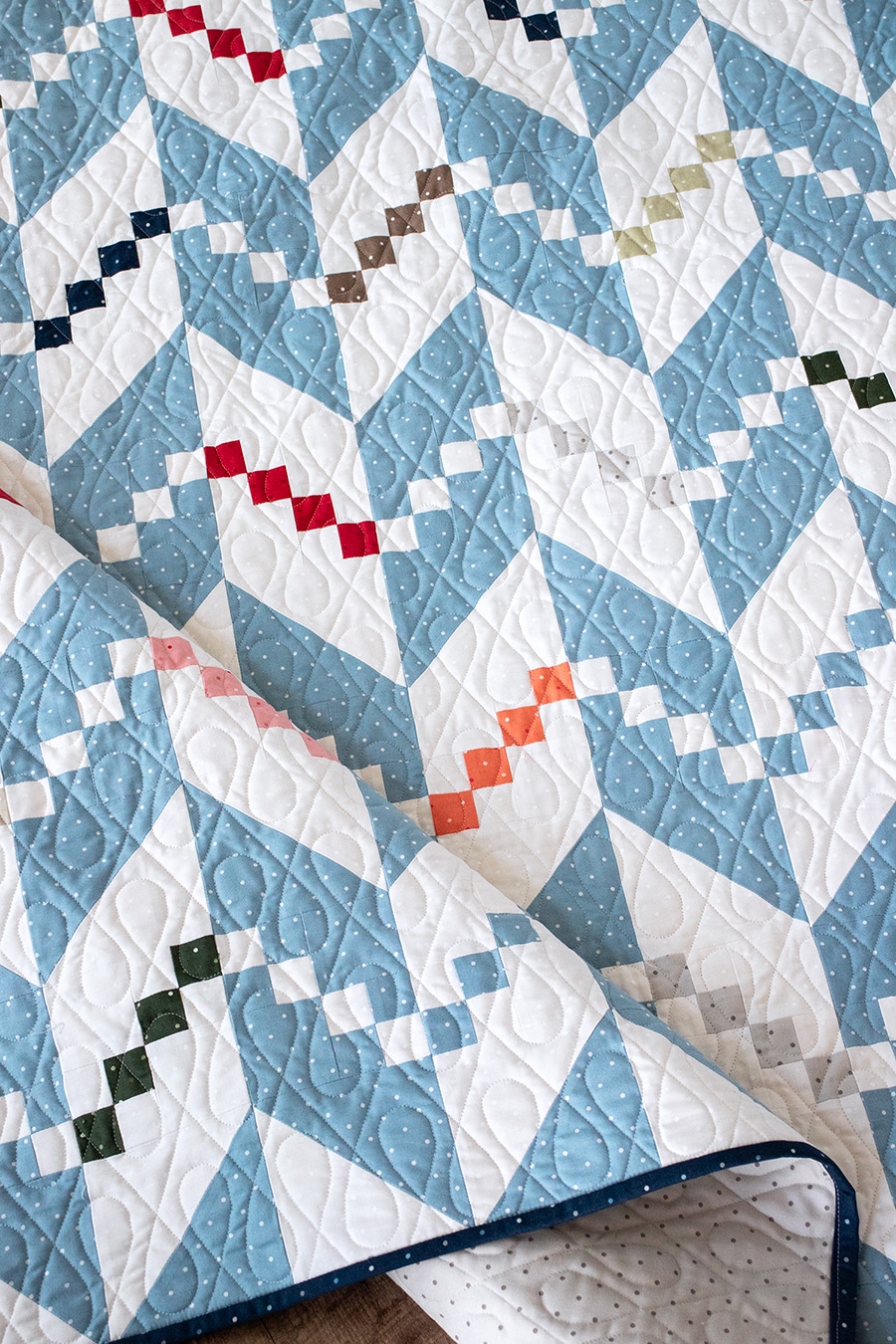 Persnickety knit herringbone quilt pattern in Magic Dot fabric by Lella Boutique for Moda Fabrics. Make it with a Layer Cake or charm packs. Download the PDF here!