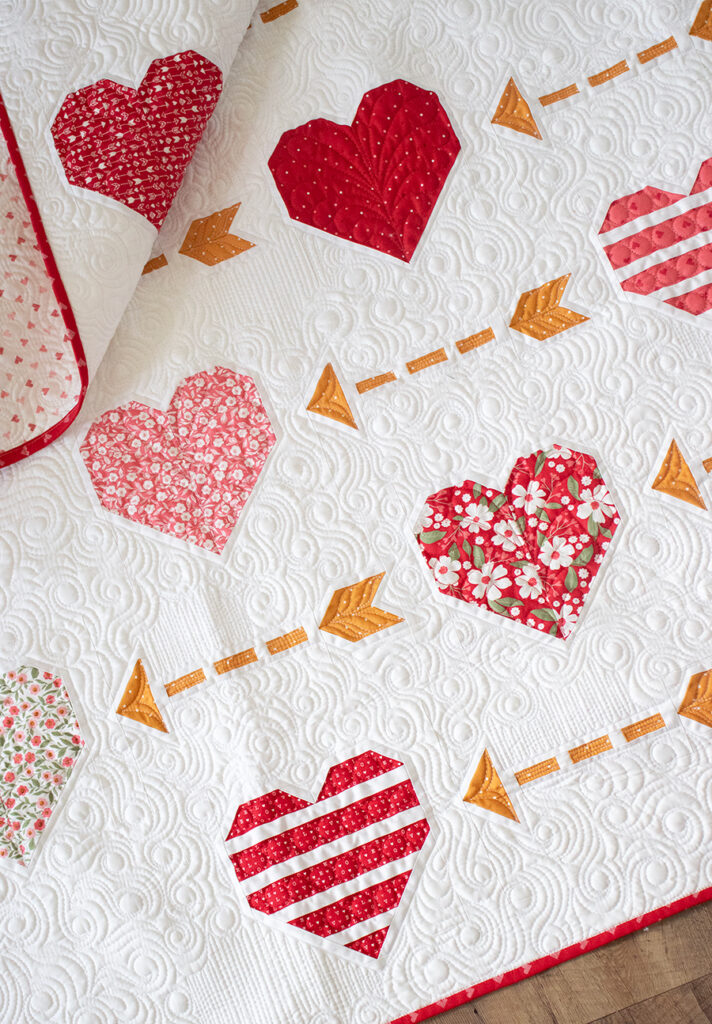 Playing Cupid (Heart and Arrow Quilt) - Lella Boutique