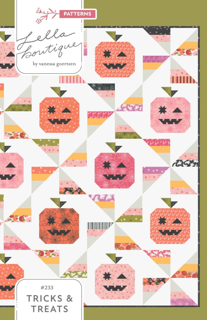 "Tricks and Treats" Halloween quilt by Vanessa Goertzen. Design features cute patchwork pumpkins with winky faces and scrappy candy corn pinwheels. Fabric is Hey Boo by Lella Boutique for Moda Fabrics. Download the PDF here!