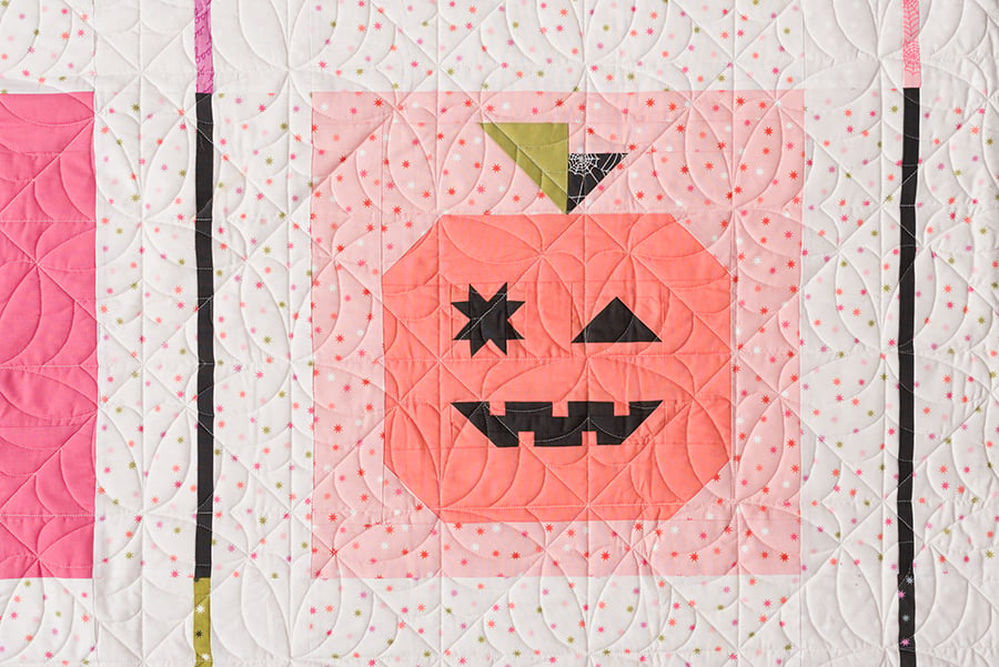 Cute "Jack O' Lantern" quilt block by Lella Boutique in Hey Boo fabric. Cute patchwork pumpkin with a winky face. Download the PDF here!