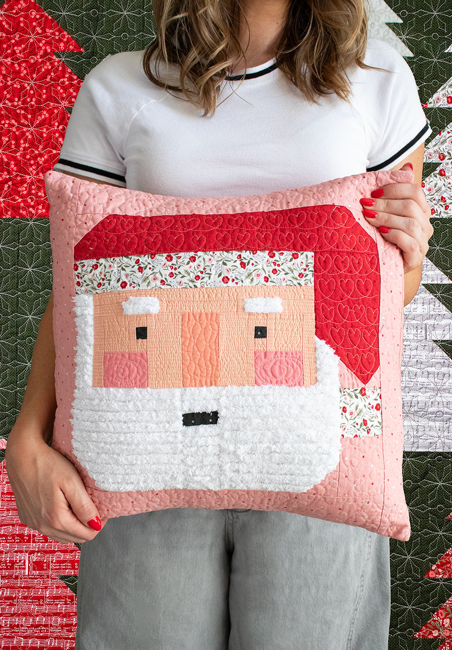 Make a festive Santa patchwork pillow with a fluffy Chenille-It beard. Learn Vanessa's tips & tricks to making one for yourself. Fabric is Berry & Pine by Lella Boutique for Moda Fabrics.