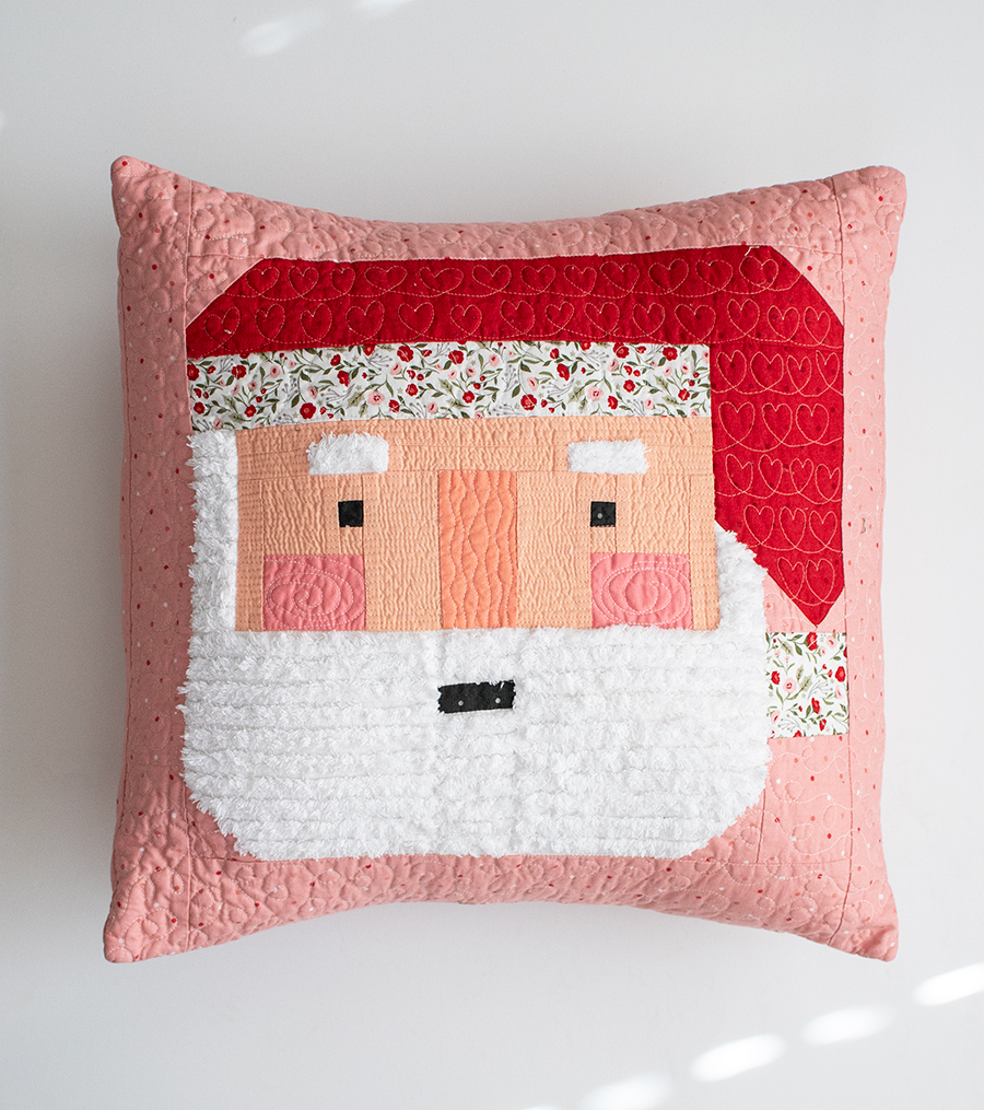 Make a festive Santa patchwork pillow with a fluffy Chenille-It beard. Learn Vanessa's tips & tricks to making one for yourself. Fabric is Berry & Pine by Lella Boutique for Moda Fabrics.