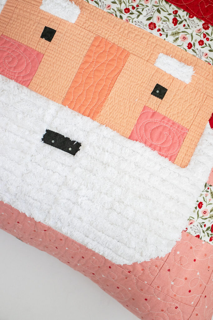 Make a festive Santa patchwork pillow with a fluffy Chenille-It beard. Learn Vanessa's tips & tricks to making one for yourself. Fabric is Berry & Pine by Lella Boutique for Moda Fabrics.