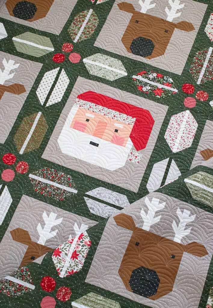 "Christmas Crew" Santa and reindeer quilt in Berry & Pine fabric by Lella Boutique. The holly and berry sashing is Jelly Roll friendly too. Download the PDF here.