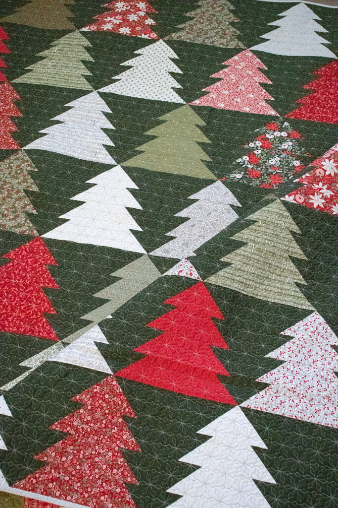 "Fir Tree Lane" geometric tree quilt in Berry & Pine fabric by Lella Boutique. Make it with fat quarters or fat eighths. Download the PDF here!