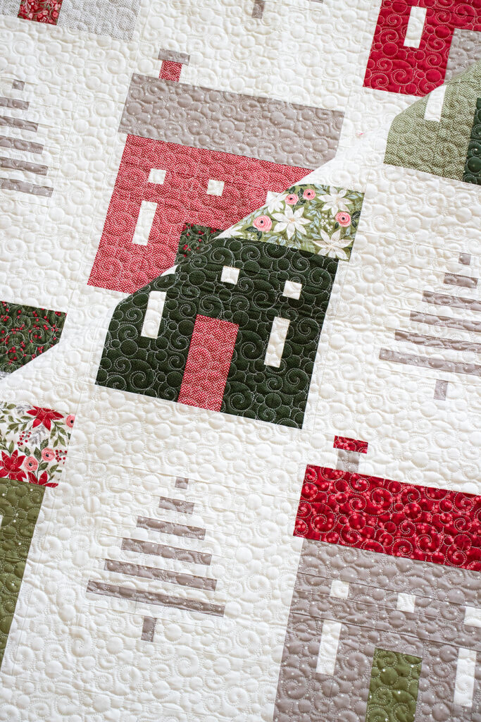 "Holiday House" Christmas neighborhood quilt with simple tree blocks. Fabric is Berry & Pine by Lella Boutique for Moda Fabrics. Download the PDF here!