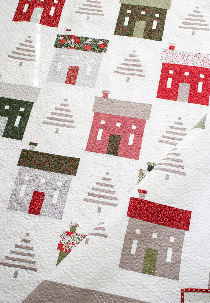 "Holiday House" Christmas neighborhood quilt with simple tree blocks. Fabric is Berry & Pine by Lella Boutique for Moda Fabrics. Download the PDF here!