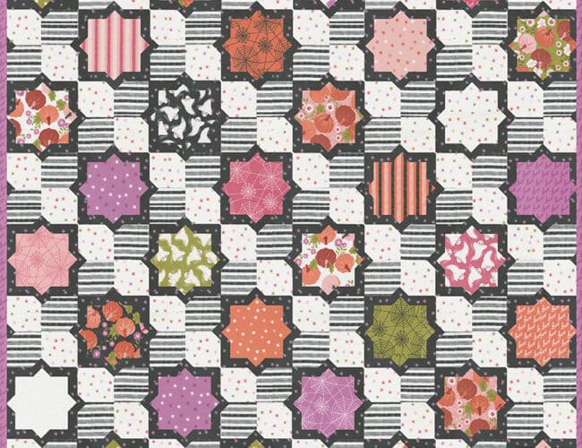 Hubba Hubba tile quilt in Hey Boo fabric by Lella Boutique. Make it extra scrappy by splitting the background between two prints.