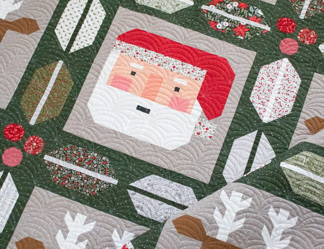 "Christmas Crew" Santa and reindeer quilt with cute holly and berry sashing by Lella Boutique. Jelly Roll friendly, fabric is Berry & Pine by Lella Boutique for Moda Fabrics (May 2025). Download the PDF here!