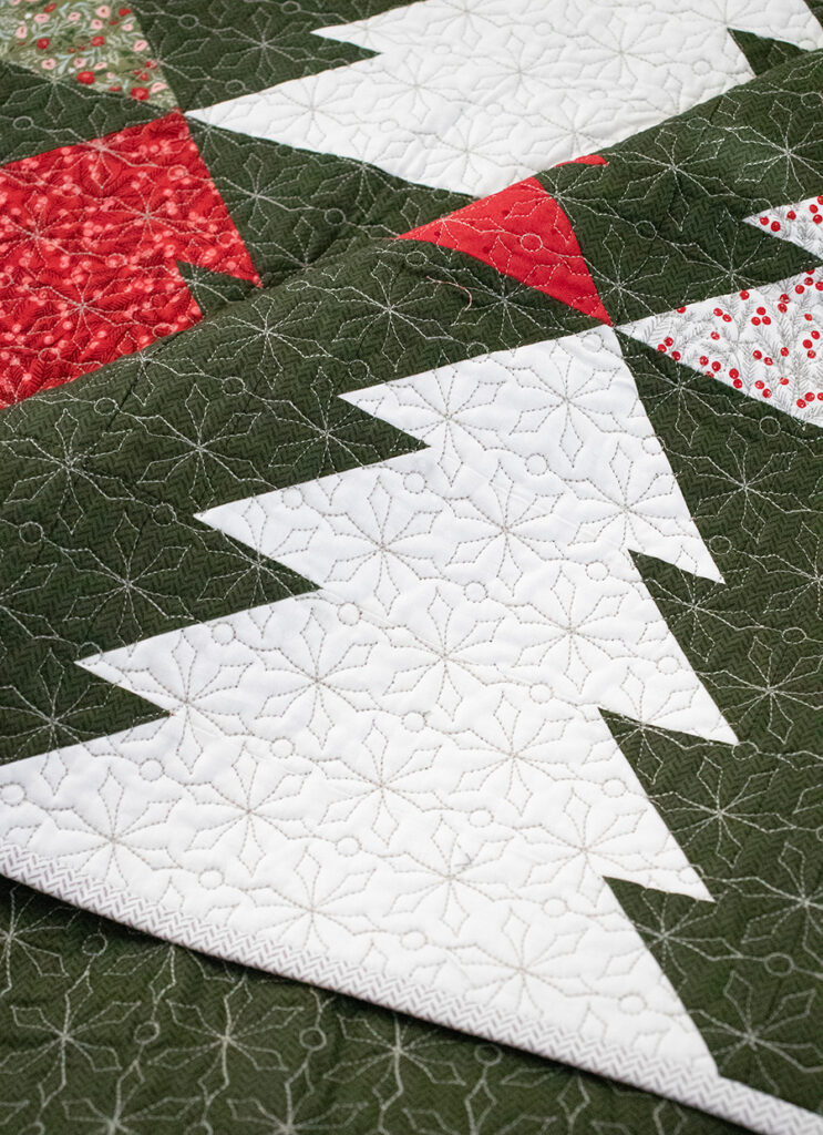 "Fir Tree Lane" geometric Christmas tree quilt. Make it with fat quarters or fat eighths. Fabric is Berry & Pine by Lella Boutique for Moda Fabrics. Download the PDF here!