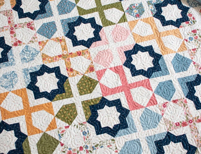 "Dreamer" star tile quilt is a stunner. Make it with a layer cake or fat eighths. Fabric is Wild Honey by Lella Boutique for Moda Fabrics. Download the PDF here.