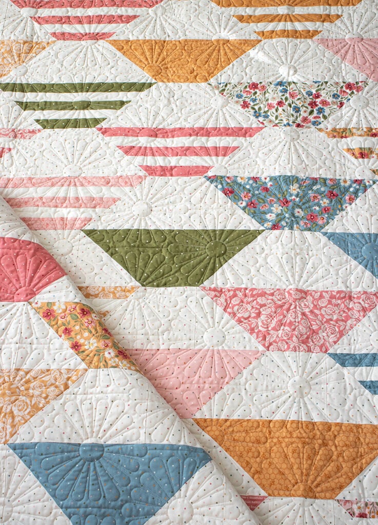 "Honey Glow" honeycomb hexagon quilt by Lella Boutique. Make it with a honeybun + fat quarters. Fabric is Wild Honey (Nov 2025). Download the PDF here.