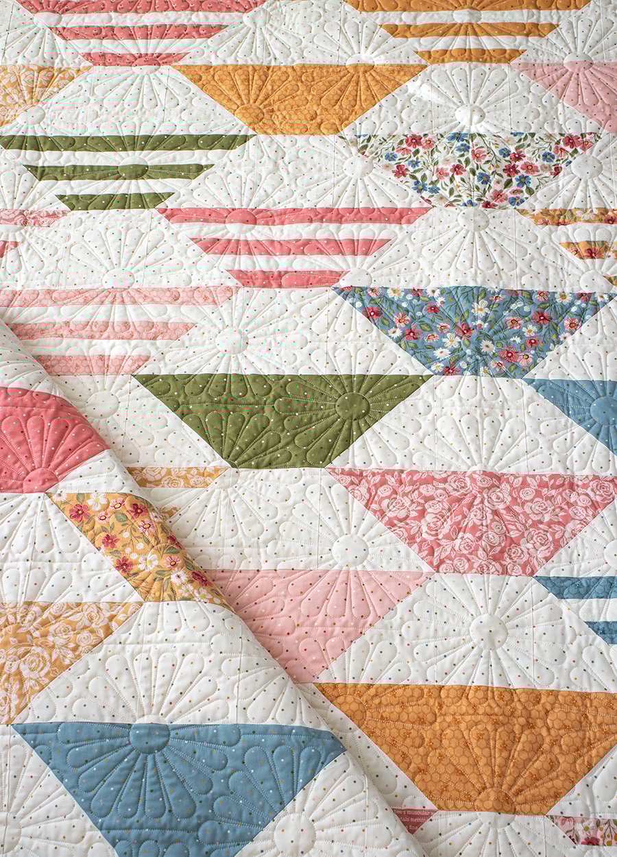 "Honey Glow" honeycomb hexagon quilt by Lella Boutique. Make it with a honeybun + fat quarters. Fabric is Wild Honey (Nov 2025). Download the PDF here.