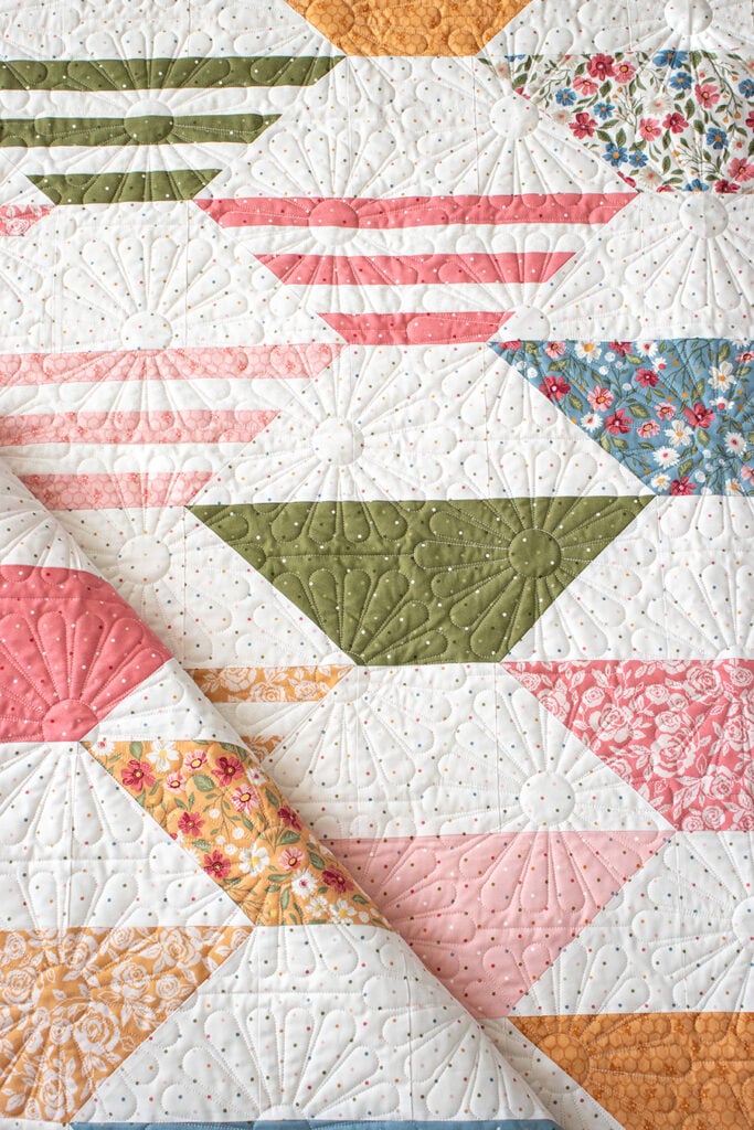 "Honey Glow" honeycomb hexagon quilt by Lella Boutique. Make it with a honeybun + fat quarters. Fabric is Wild Honey (Nov 2025). Download the PDF here.