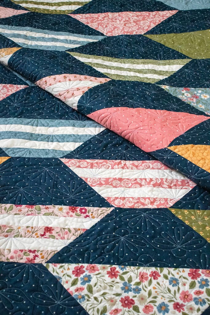 "Honey Glow" honeycomb hexagon quilt by Lella Boutique. Make it with a honeybun + fat quarters. Fabric is Wild Honey (Nov 2025). Download the PDF here.