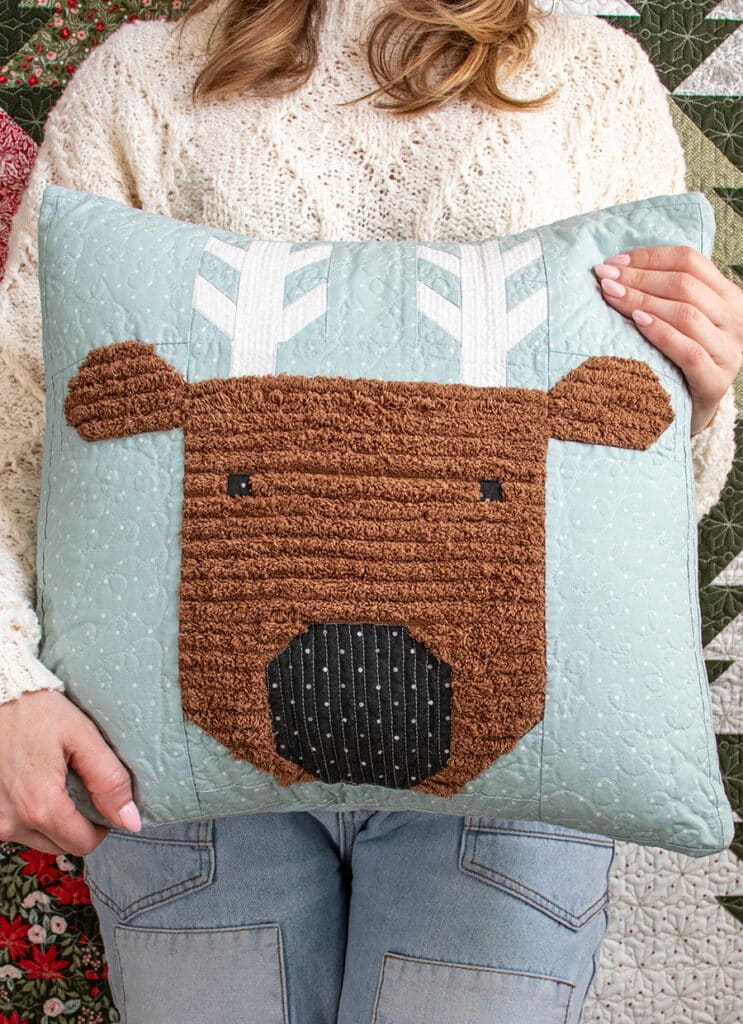 Merry Reindeer pillow in Magic Dot fabric by Lella Boutique. Make it with or without a fluffy Chenille-It "fur" embellishment. Download the PDF here!