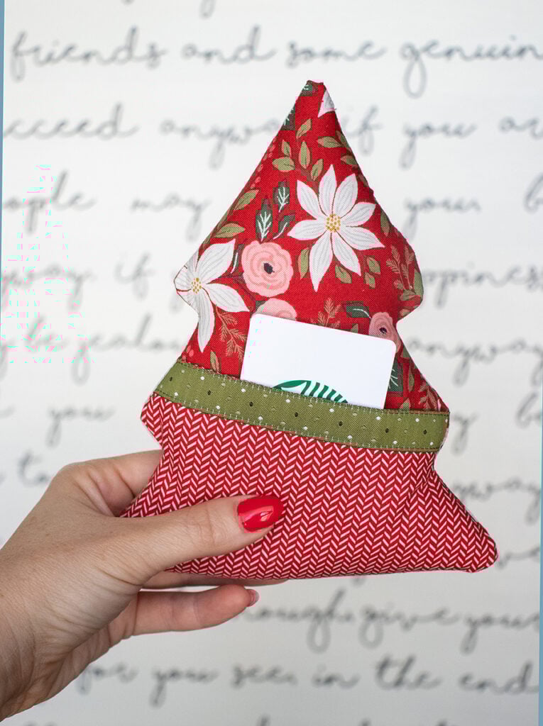 "Spruce It Up" stuffed tree pattern featuring a pocket for treats or love notes. Fabric and ribbon is Berry & Pine by Lella Boutique for Moda Fabrics. Download the PDF here.