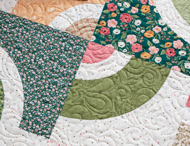"Dishes" beginner curve quilt using the Circle Savvy Ruler and a Layer Cake. Fabric is Garden Glam by Lella Boutique for Moda Fabrics. Download the PDF here!