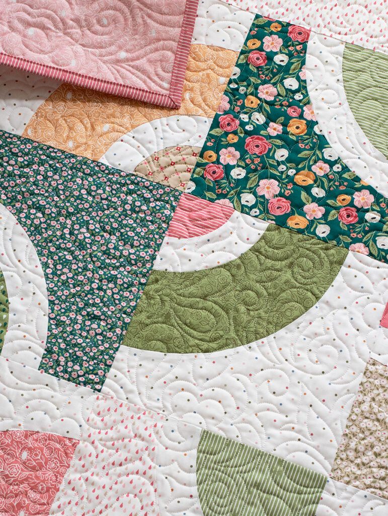 "Dishes" beginner curve quilt using the Circle Savvy Ruler and a Layer Cake. Fabric is Garden Glam by Lella Boutique for Moda Fabrics. Download the PDF here!