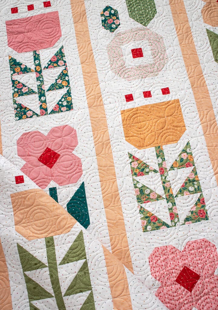 "Garden Party" flower quilt - a fat quarter quilt in Garden Glam fabric by Lella Boutique for Moda Fabrics. Download the PDF here!