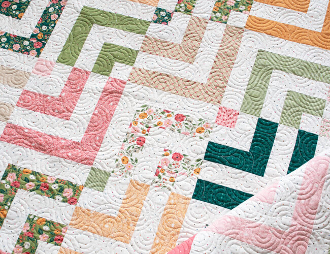 "Fresh Cut" Jelly Roll log cabin quilt in Garden Glam fabric by Lella Boutique for Moda Fabrics. Download the PDF here!