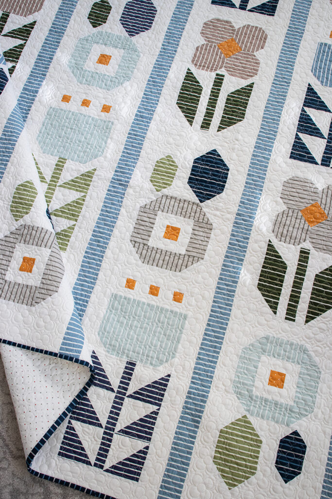 Garden Party quilt in Magic Stripe fabric by Lella Boutique for Moda Fabrics. Download the PDF here!
