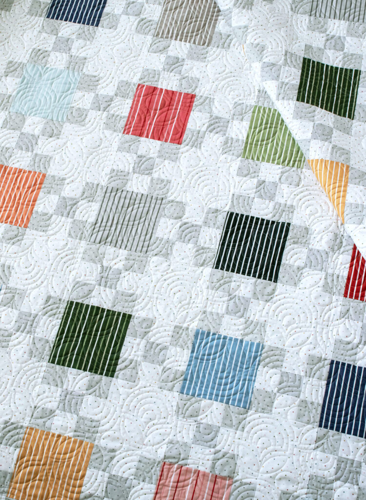 "Hopscotch" fat eighth quilt in Magic Stripe fabric. Cute free pattern by Vanessa Goertzen of Lella Boutique. Download the free PDF here!