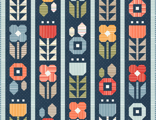 Garden Party quilt in Magic Stripe by Lella Boutique for Moda Fabrics. Beautiful prints pop against a navy background in this bold and bright patchwork flower garden. Download the PDF here!