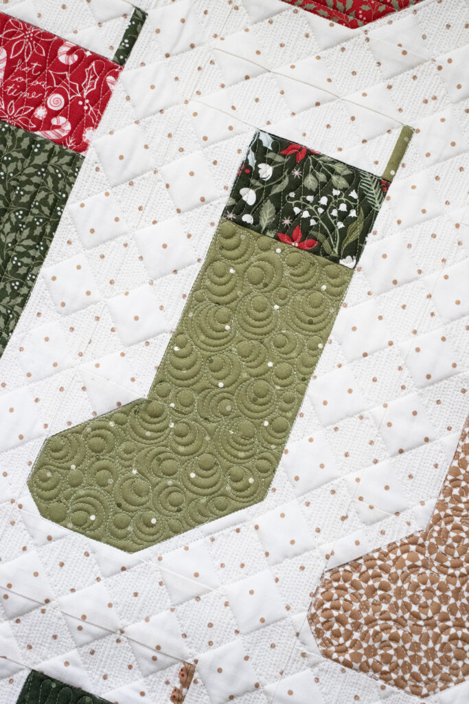 "By the Chimney Mini" stocking quilt wall hanging in Peppermint Cocoa by Lella Boutique for Moda Fabrics. Download the PDF here!