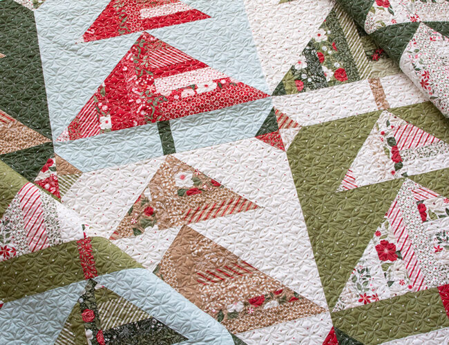 "Pine Needles" scrappy Christmas tree quilt made with a fat eighth bundle of Peppermint Cocoa fabric by Lella Boutique for Moda Fabrics. Download the PDF here!